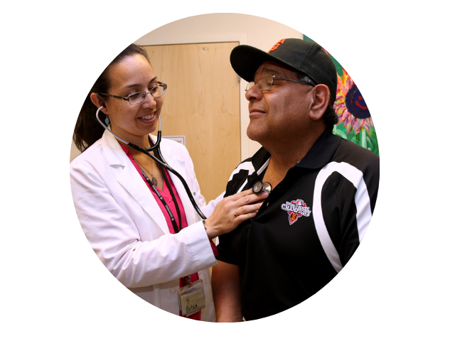 Doctor helping patient by checking their heart